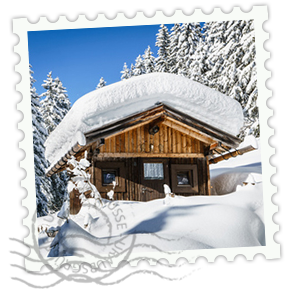 Briefmarke einer Hütte im Winter mit schneebedeckten Dach.