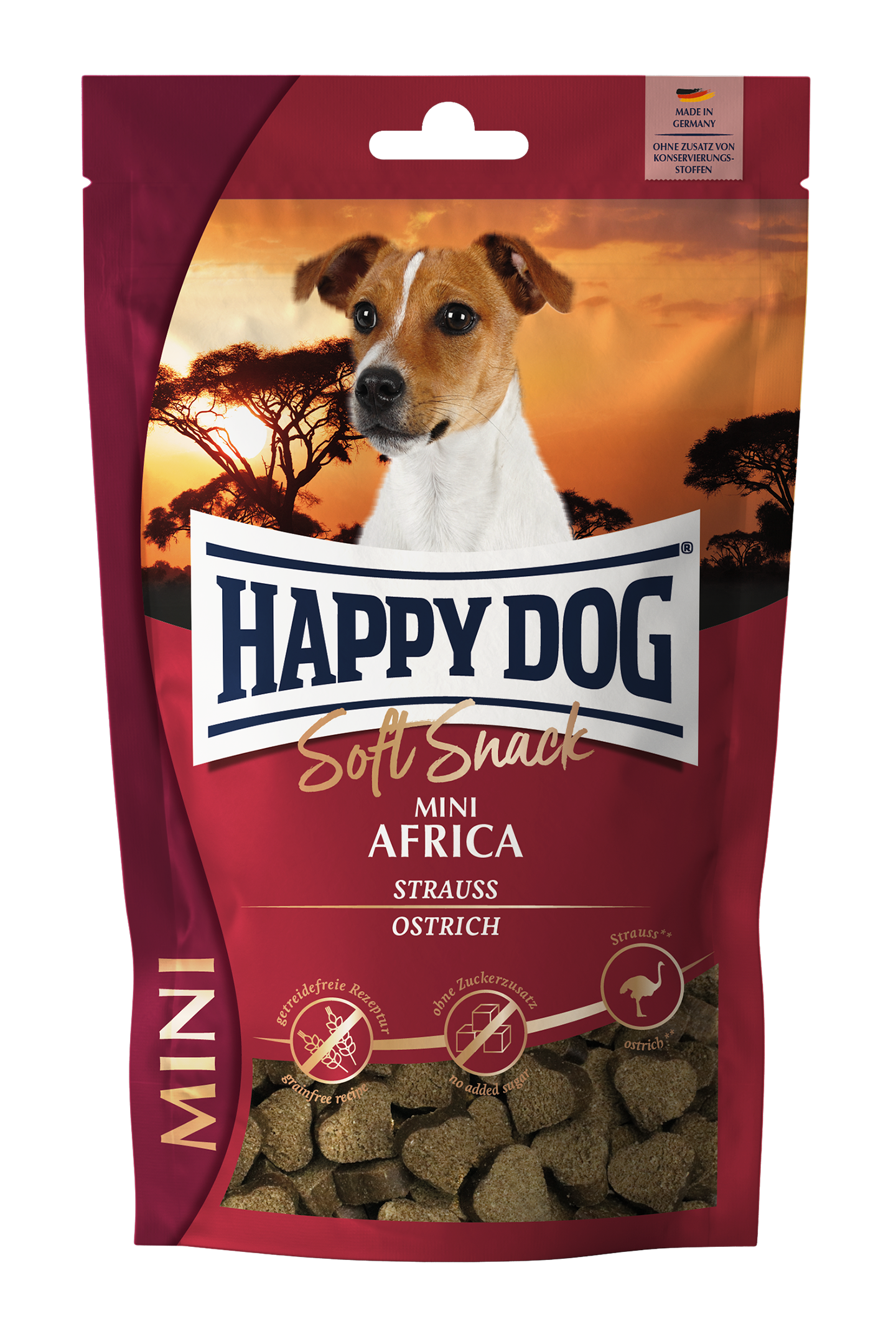 Verpackung mit Hundefutter der Marke Happydog, zeigt einen Hund vor einem Sonnenuntergang in der Savanne. Text: „Soft Snack Mini Africa Strauss Ostrich, Made in Germany, Ohne Zusatz von Konservierungsstoffen“.