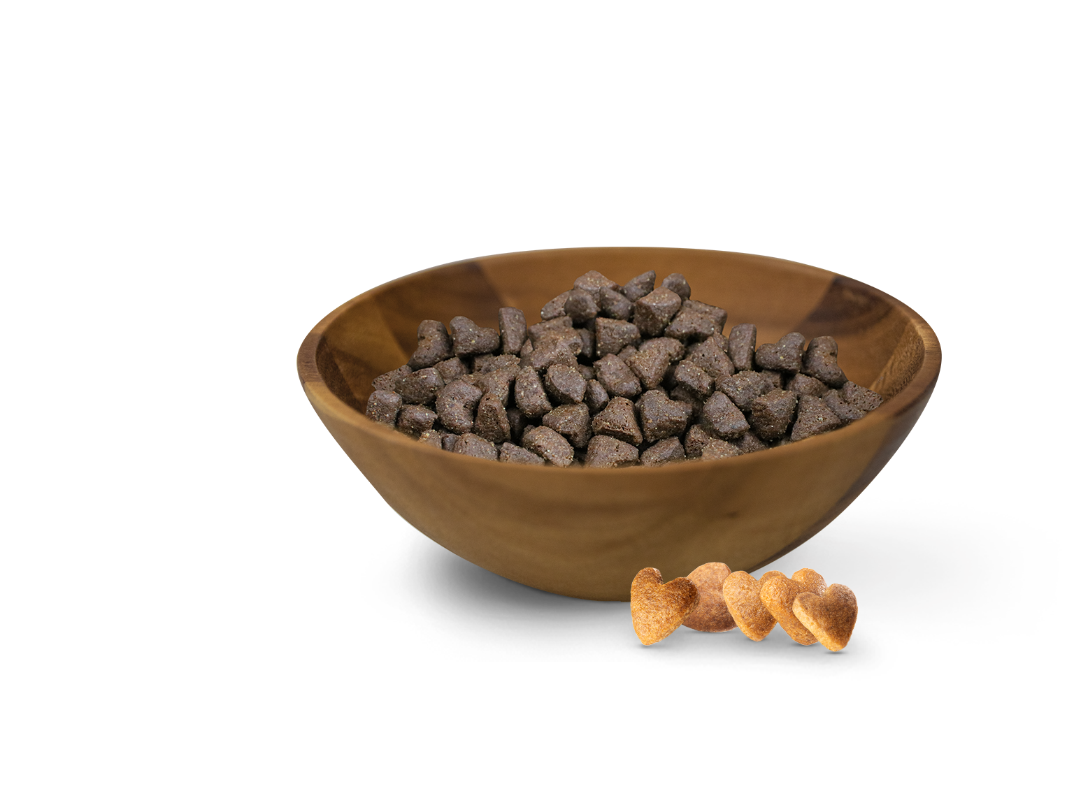 Holzschälchen mit dunklen herzförmigen Leckerlis im Inneren und hellen herzförmigen Snacks davor liegend