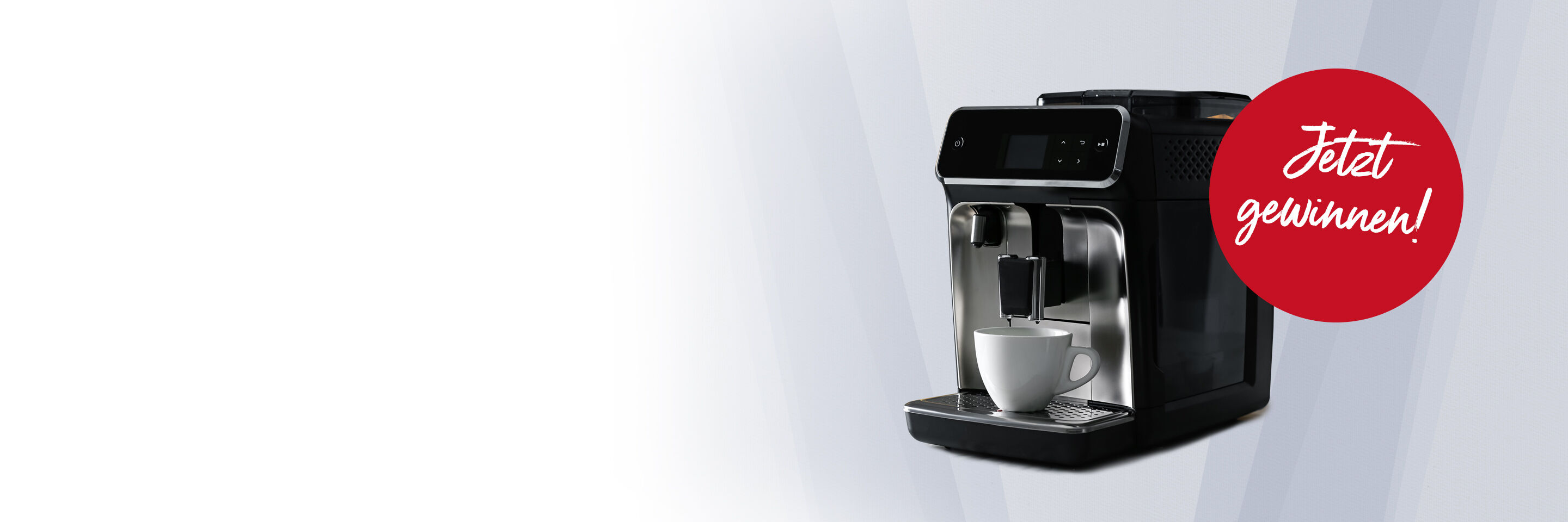 Bild eines Kaffeevollautomaten und zwei Espresso-Tassen als Hauptgewinn eines Gewinnspiels.