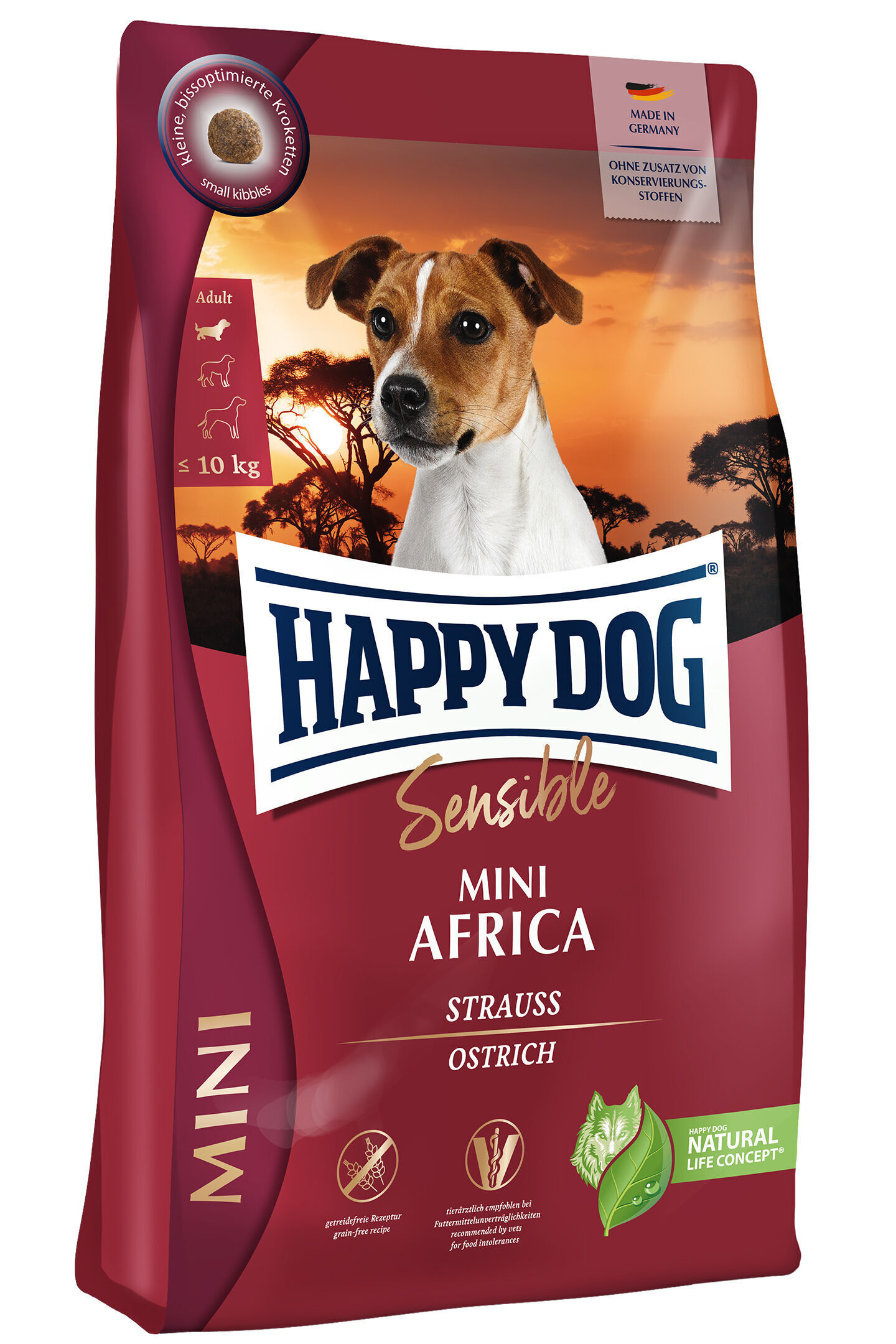 Eine Packung Hundefutter von "Happydog" für kleine Hunde unter 10 kg, Sorte "Mini Africa" mit Strauß, vor afrikanischer Savannenlandschaft. Text: „Made in Germany“, „Ohne Zusatz von Konservierungsstoffen“.