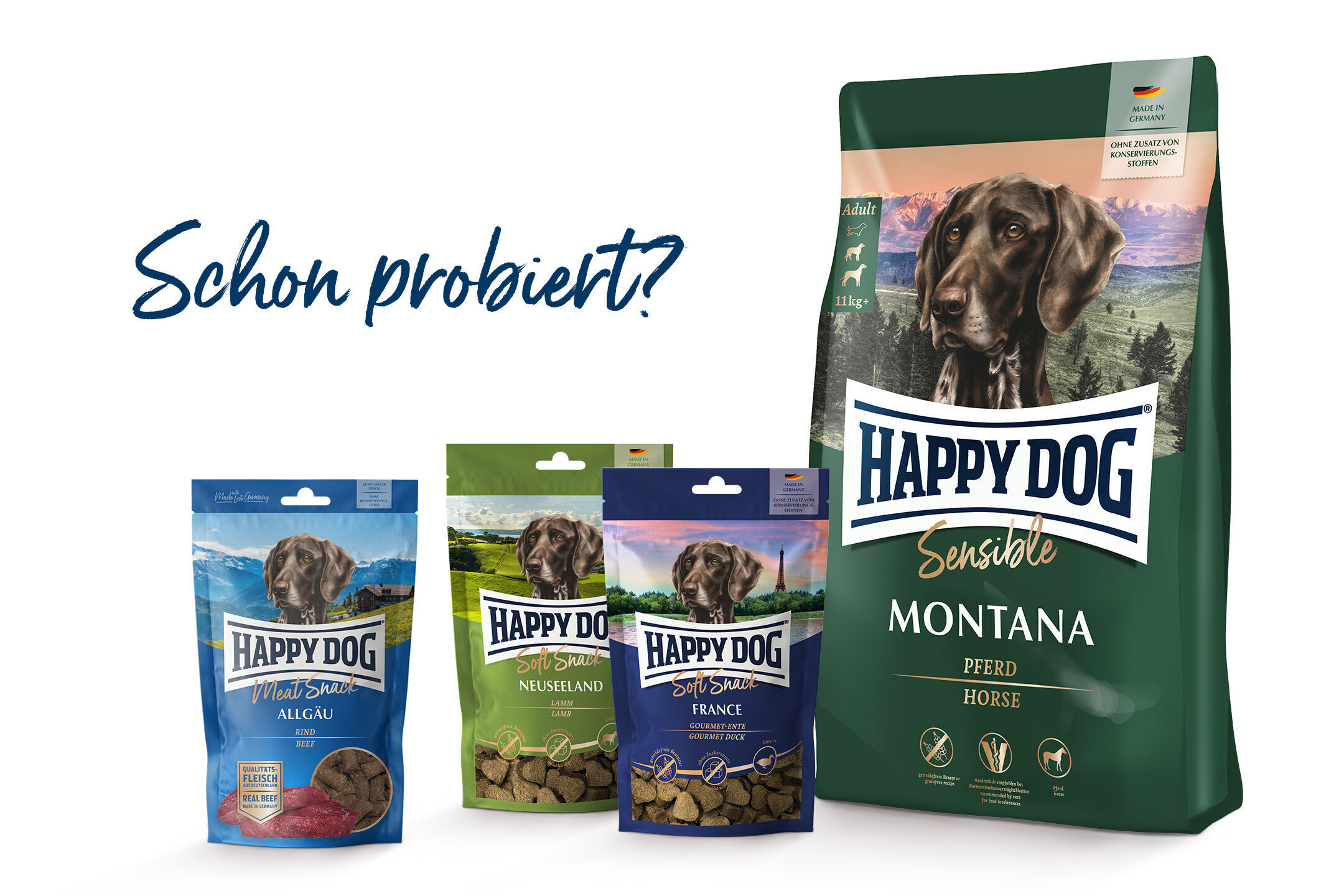 Happydog Hundefutterprodukte sind aufrecht angeordnet: Meat Snack Allgäu, Soft Snack Neuseeland, Soft Snack France und Sensible Montana. Text: "Schon probiert?".