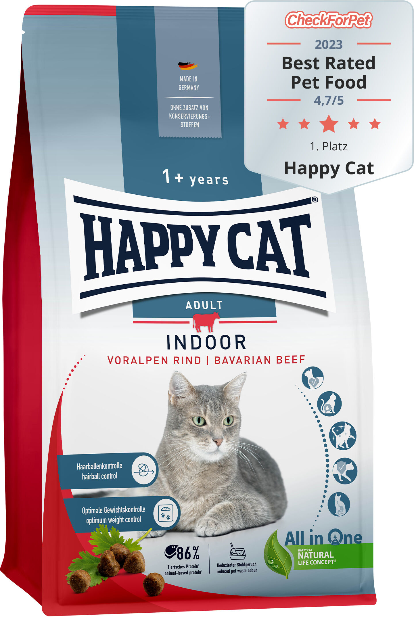 Verpackung von Katzenfutter „Happy Cat Indoor Adult“ mit Voralpen Rind, für Katzen ab einem Jahr. Hervorgehoben: Haarballen- und Gewichtskontrolle. Prüfsiegel „Best Rated Pet Food 2023“.
