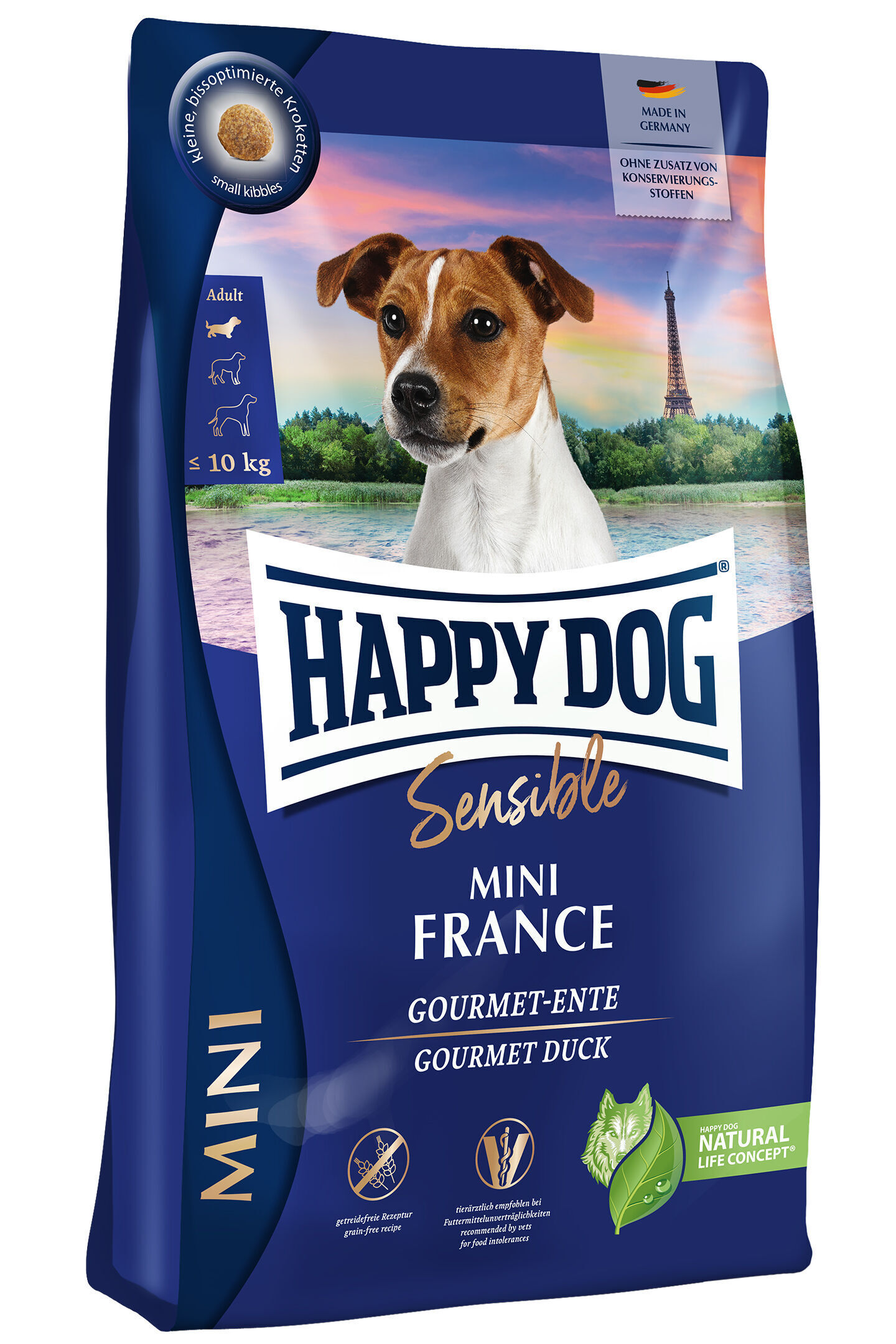 Eine Verpackung von Happydog Sensible Mini France. Darauf ein Hund vor dem Eiffelturm, die Aufschrift „Gourmet-Ente“ und Kennzeichnungen wie „getreidefrei“ und „ohne Zusatz von Konservierungsstoffen“.