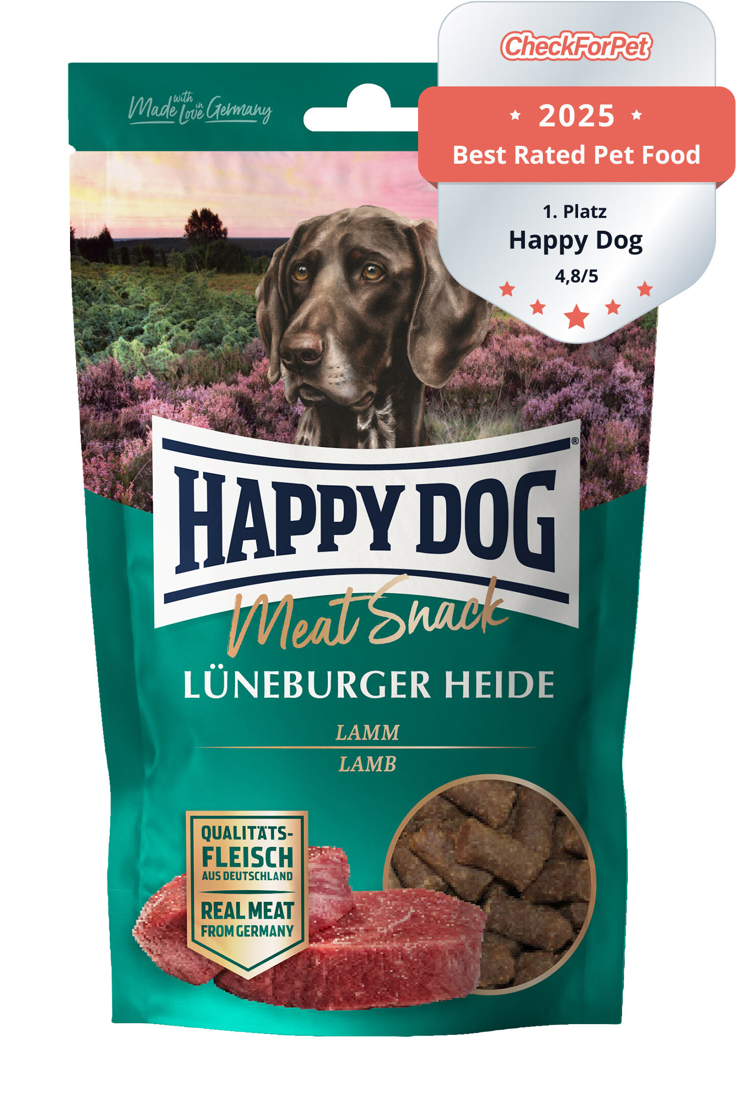 Verpackung eines Hundesnacks mit Lammgeschmack. "Happy Dog Meat Snack Lüneburger Heide" steht auf der Tüte, die einen Hund in einer Heidelandschaft zeigt. Enthält Qualitätsfleisch aus Deutschland.