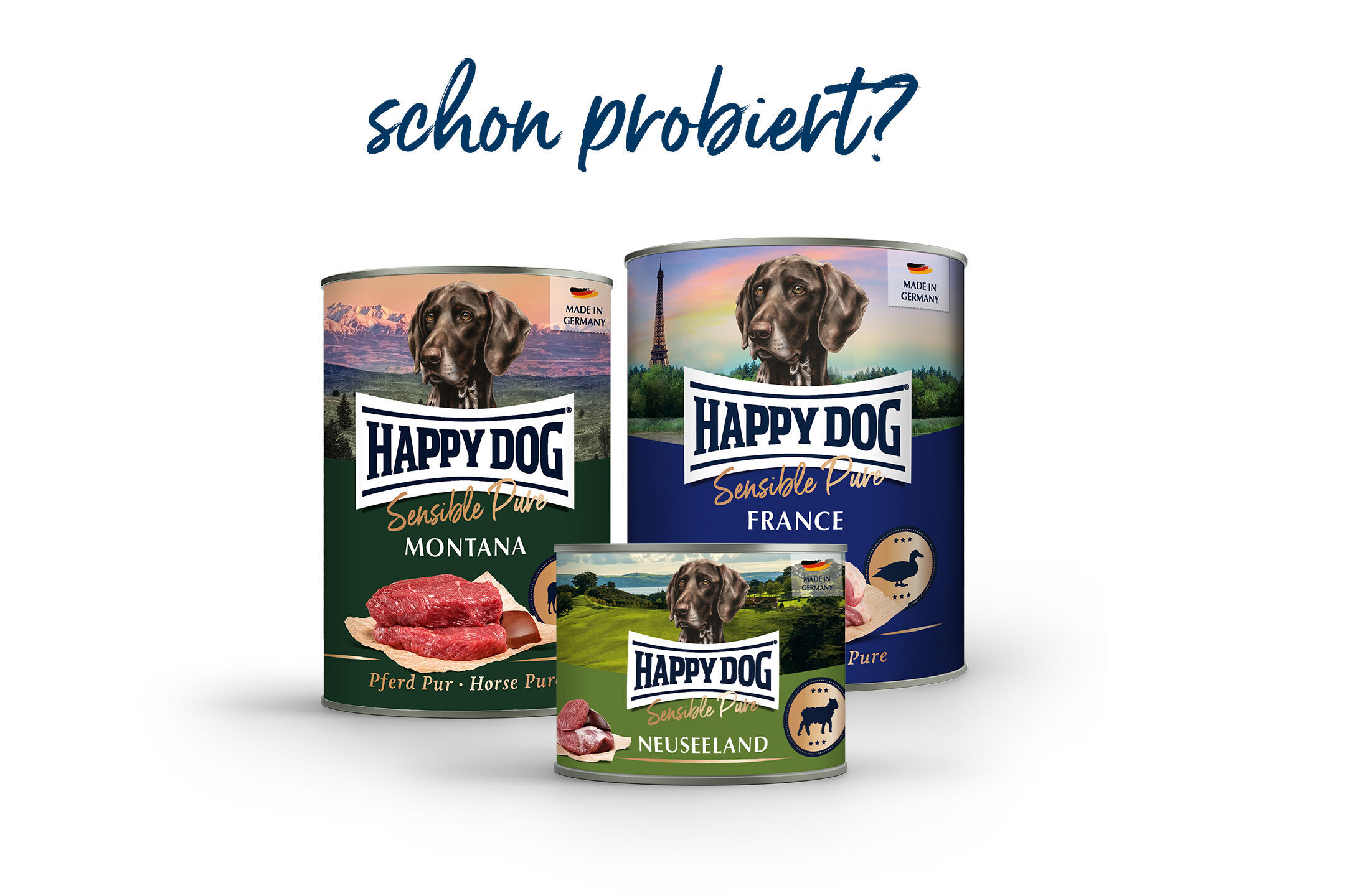Drei Hundedosen von Happydog, beschriftet mit "Montana", "France" und "Neuseeland", vor Landschaftshintergründen, darüber der Text "schon probiert?".