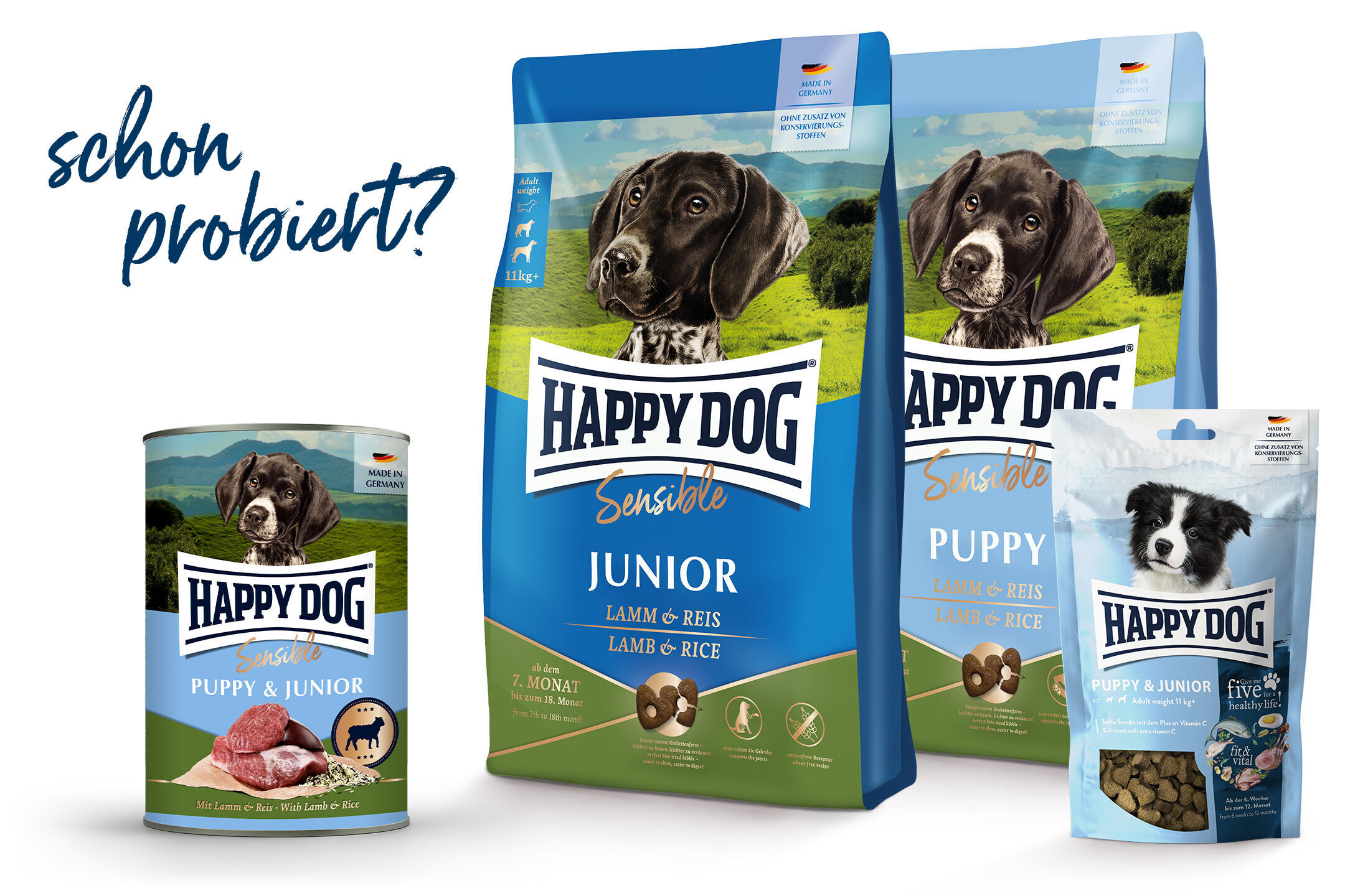 Hundeprodukte von Happydog mit Lamm und Reis. Verpackungen zeigen verschiedene Alters- und Entwicklungsstufen für Welpen und Junghunde. Text: "schon probiert?", "Made in Germany".