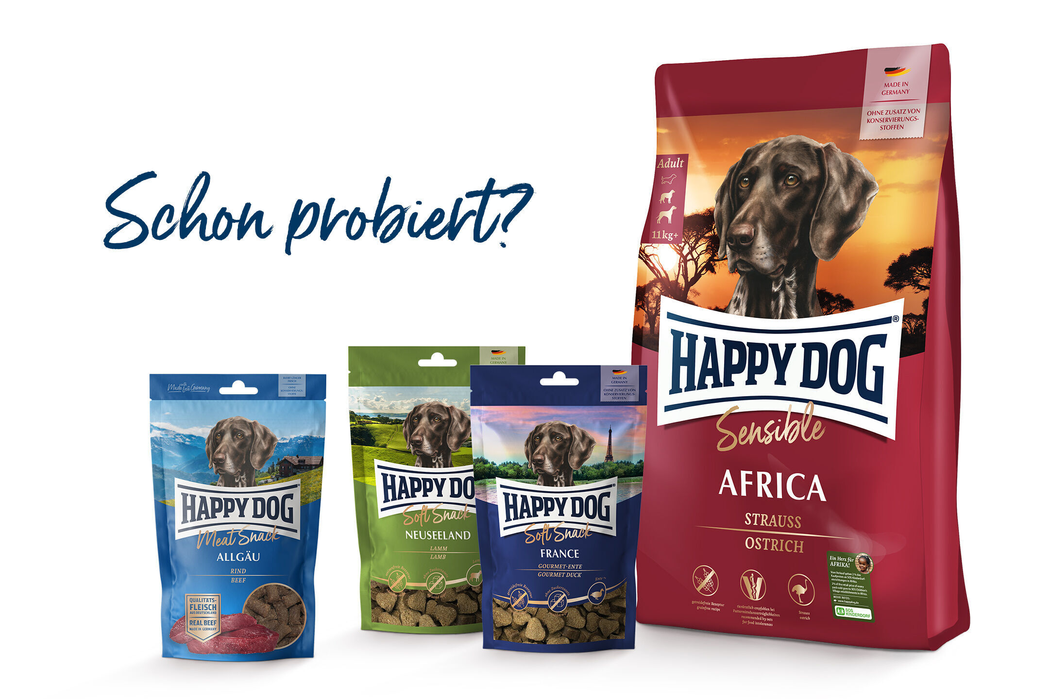 Hundefutter von Happydog in verschiedenen Sorten, darunter "Africa" und "Sensible". Auf der linken Seite drei Verpackungen, rechts eine große Tüte. Schriftzug: „Schon probiert?“