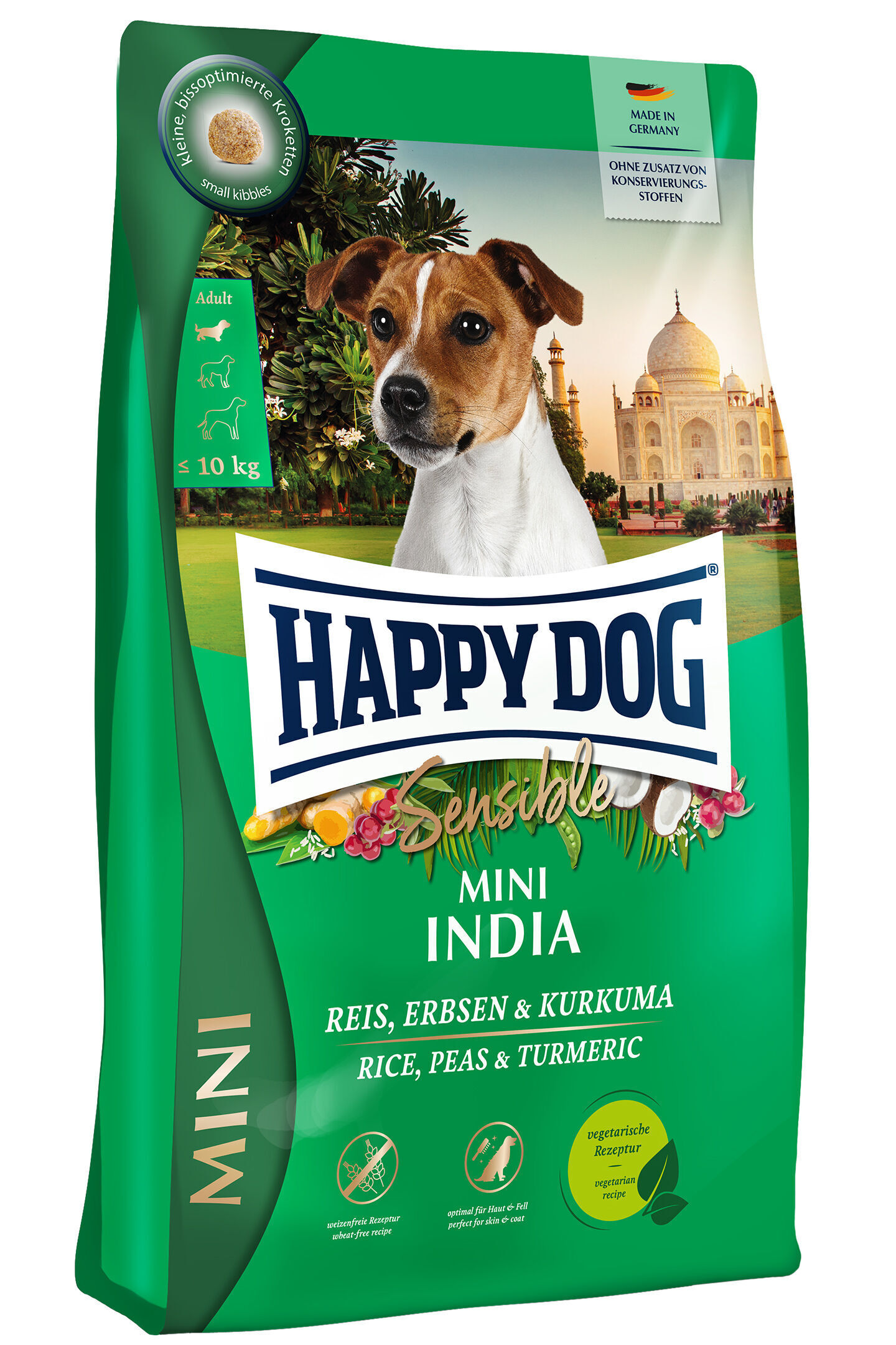 Verpackung von Happydog-Hundefutter. Ein kleiner Hund vor indischer Kulisse. Beschriftung: „Happydog Sensible Mini India, Reis, Erbsen & Kurkuma“. Designed für Hunde bis 10 kg, ohne Konservierungsstoffe.
