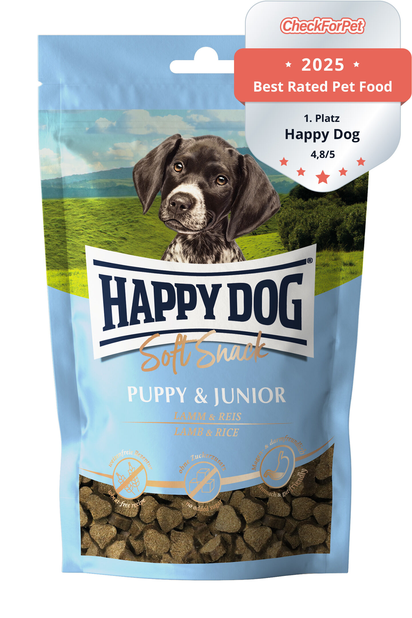 Verpackung für Happydog Soft Snack, Puppy & Junior Lamm & Reis. Zeigt Hundebild, Berge im Hintergrund. Text: „Made in Germany, ohne Zusatz von Konservierungsstoffen“. Enthält herzförmige Snacks.