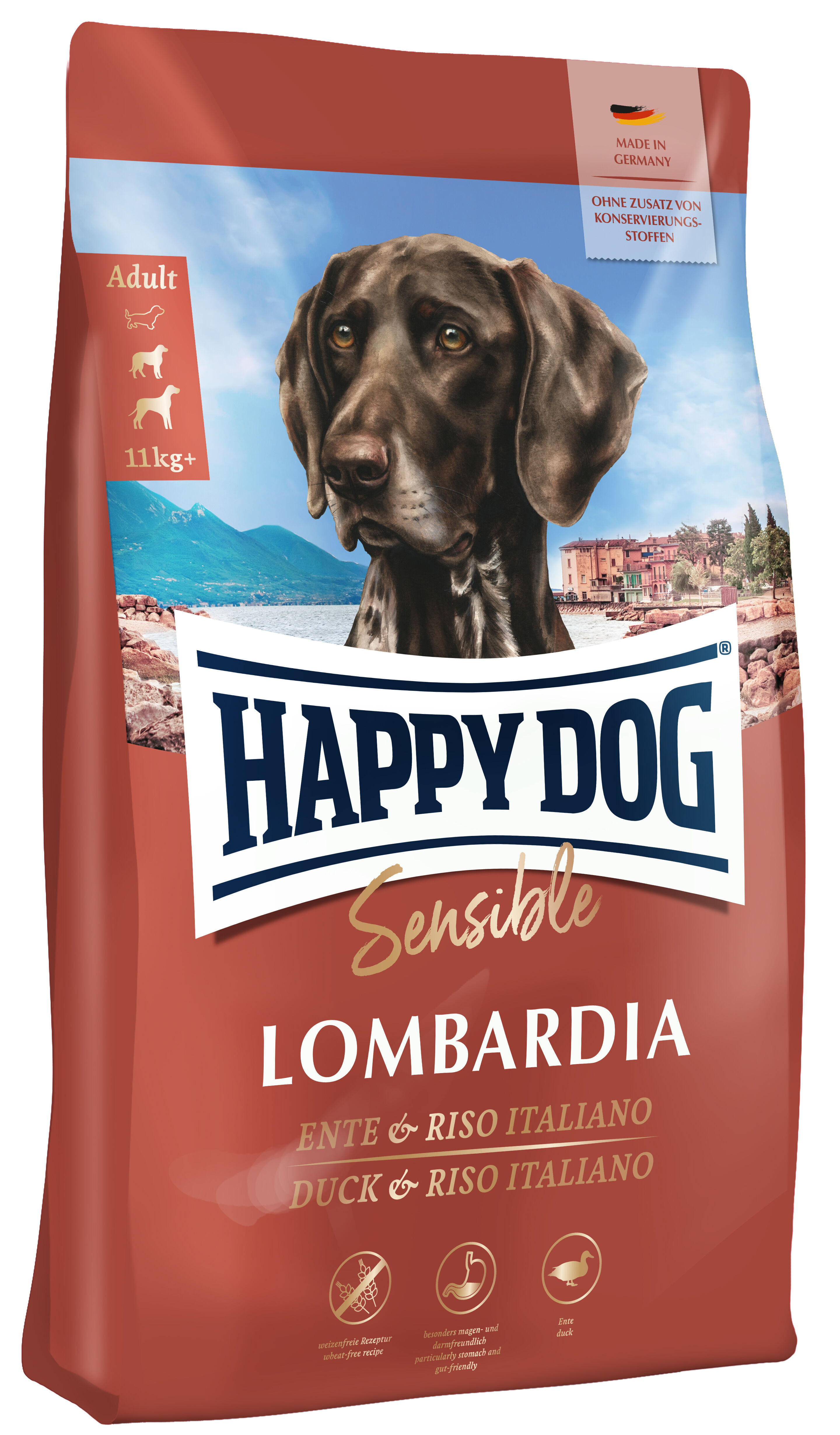 Hundefutterpackung "Happy Dog Sensible Lombardia" & Riso Italiano fรผr Hunde ab 11 kg, ohne Zusatz von Konservierungsstoffen, made in Germany, vor malerischer Landschaftsillustration.