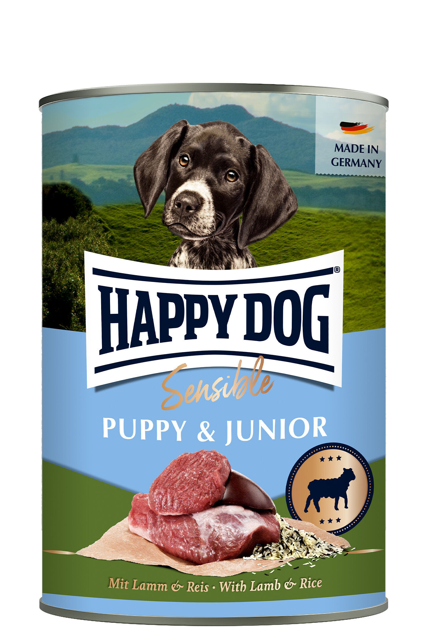 Sensible Puppy & Junior - Lamb & Rice (lamm & ris) Hundefutterdose mit Welpenbild, Text „HAPPY DOG Sensible PUPPY & JUNIOR“, Lamm und Reis, Landschaftshintergrund, „MADE IN GERMANY“-Label.