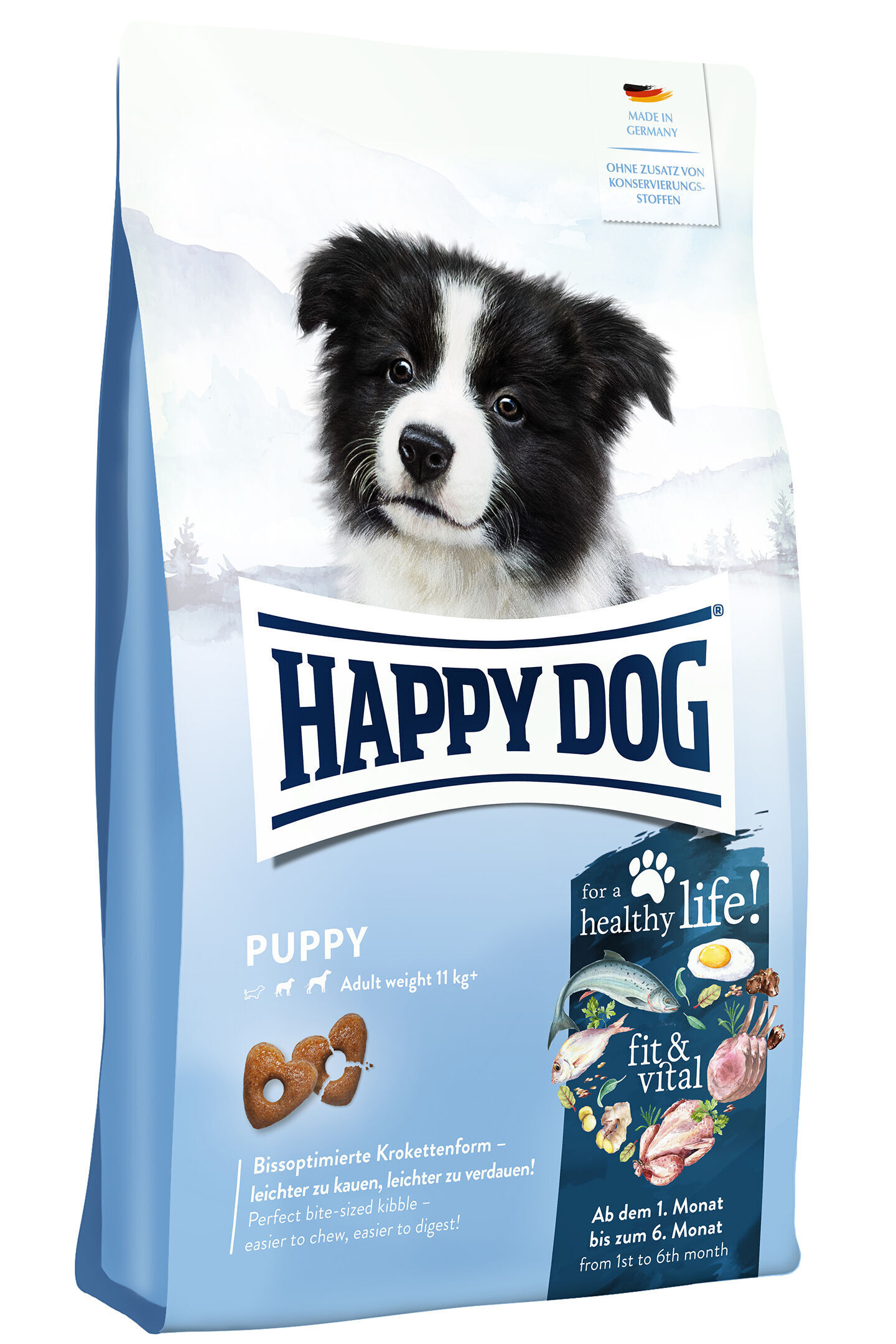 Verpackung mit Hundewelpenbild, „Happy Dog Puppy“ in Blau, Text: „Bissoptimierte Krokettenform – leichter zu kauen, leichter zu verdauen!“ und „Made in Germany“. Für gesundes Wachstum.