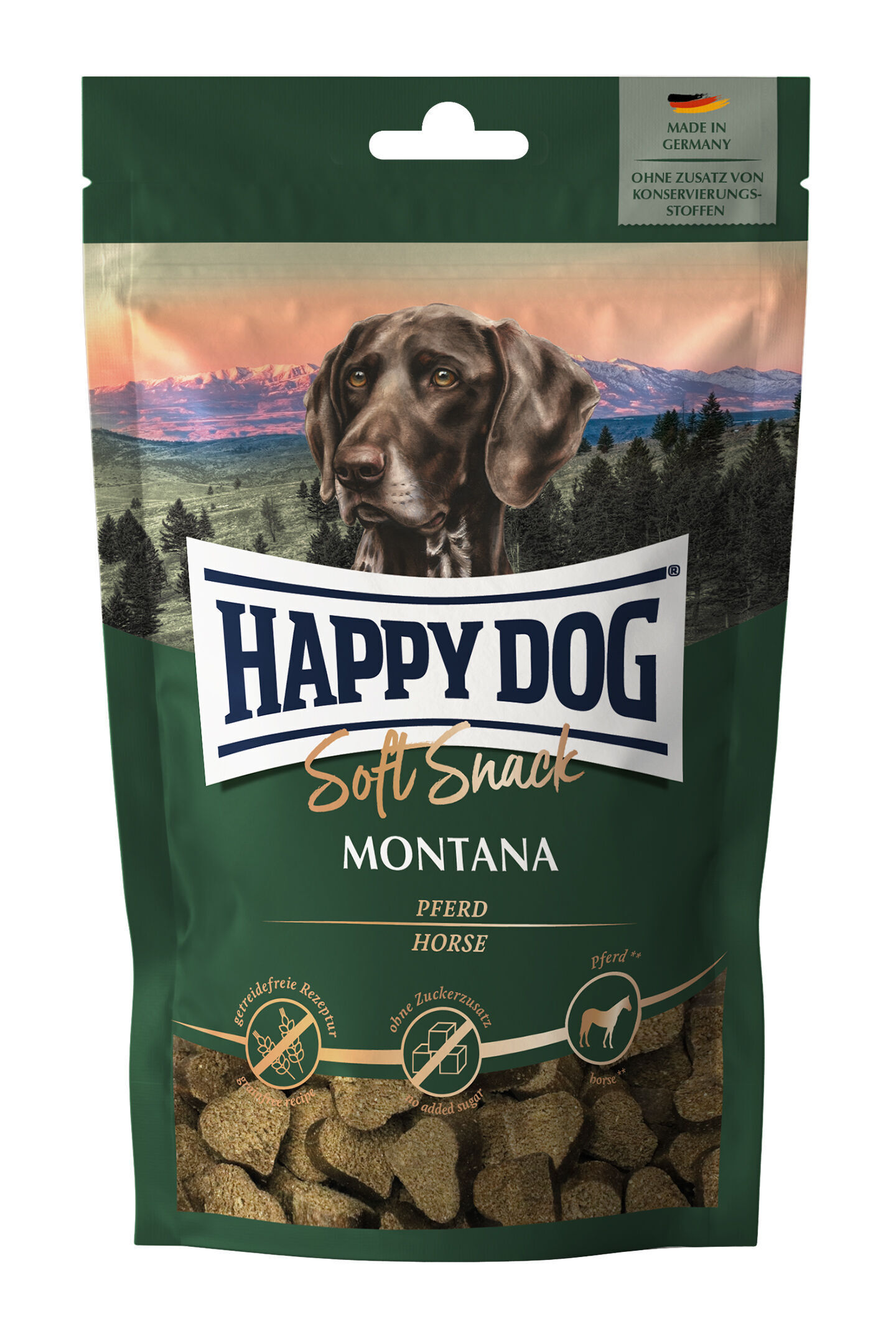 Verpackung mit Happydog-Logo zeigt Hundefutter „Soft Snack Montana“ mit Pferdefleisch. Beschriftung: „Made in Germany“, „Ohne Zusatz von Konservierungsstoffen“, „Getreidefreie Rezeptur“, „Ohne Zuckerzusatz“.