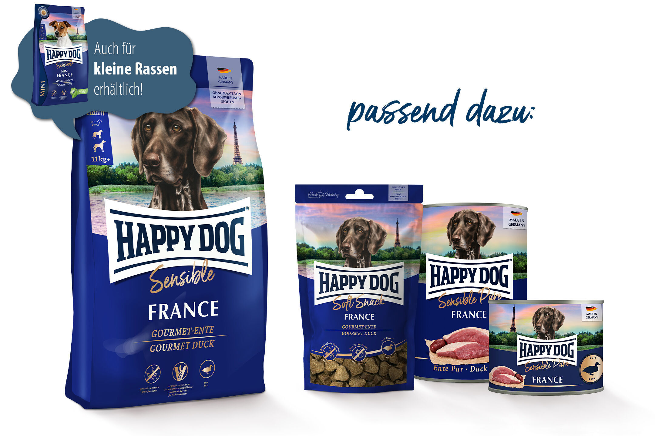 Hundeprodukte der Marke Happy Dog, inklusive Trockenfutter und Snacks, abgebildet vor einem Eiffelturm-Hintergrund. Text: „Auch für kleine Rassen erhältlich, passend dazu.“