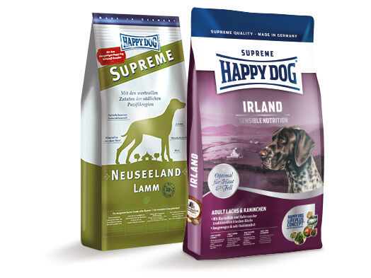 Produktverpackungen von Happy Dog in den Sorten Irland und Neuseeland.