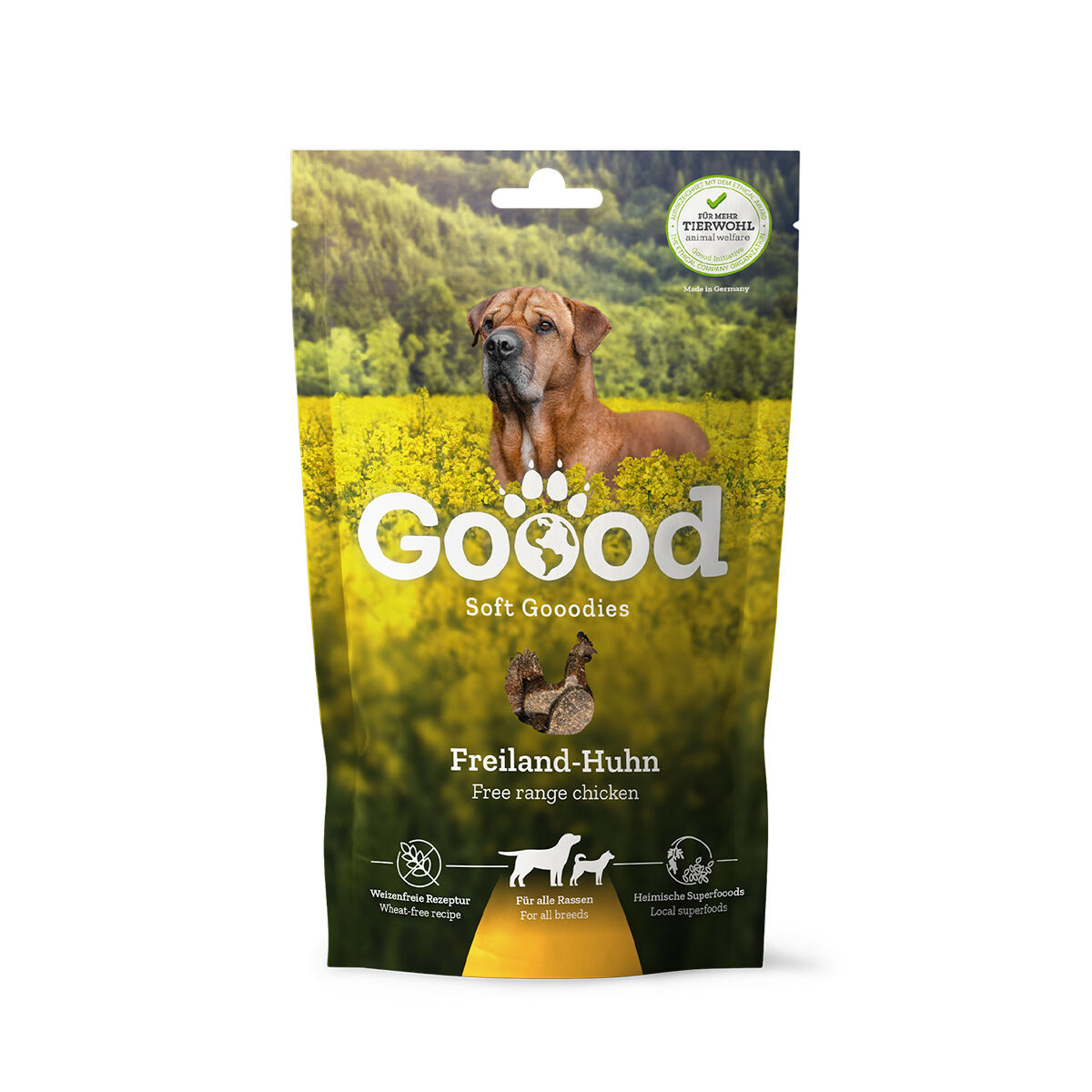 Verpackung für Hundesnacks mit "Goood Soft Goodies" und "Freiland-Huhn". Abbildungen: Hund in Feld, Lebensmittelplaketten, Text: "Weizenfreie Rezeptur", "Für alle Rassen", "Heimische Superfoods".