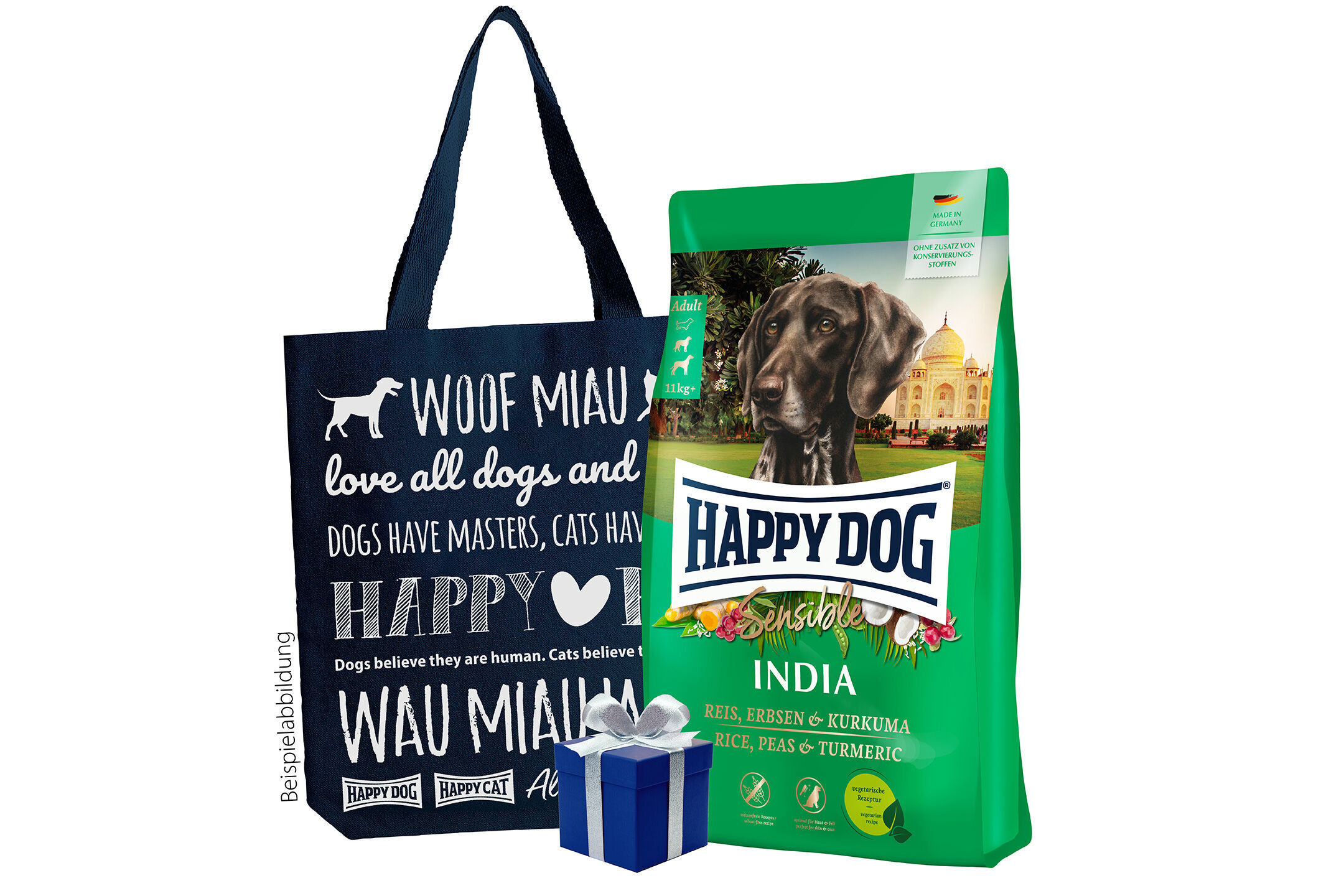 Einkaufstasche mit Text „Woof Miau“ und Packung „Happy Dog Sensible India“ Hundefutter, dekoriert mit blauem Geschenk.