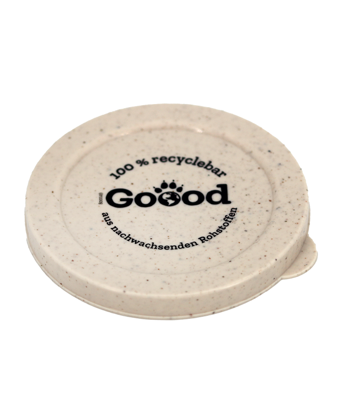 Runder, beigefarbener Deckel mit der Aufschrift „Goood, 100% recyclebar aus nachwachsenden Rohstoffen“, repräsentiert Nachhaltigkeit.