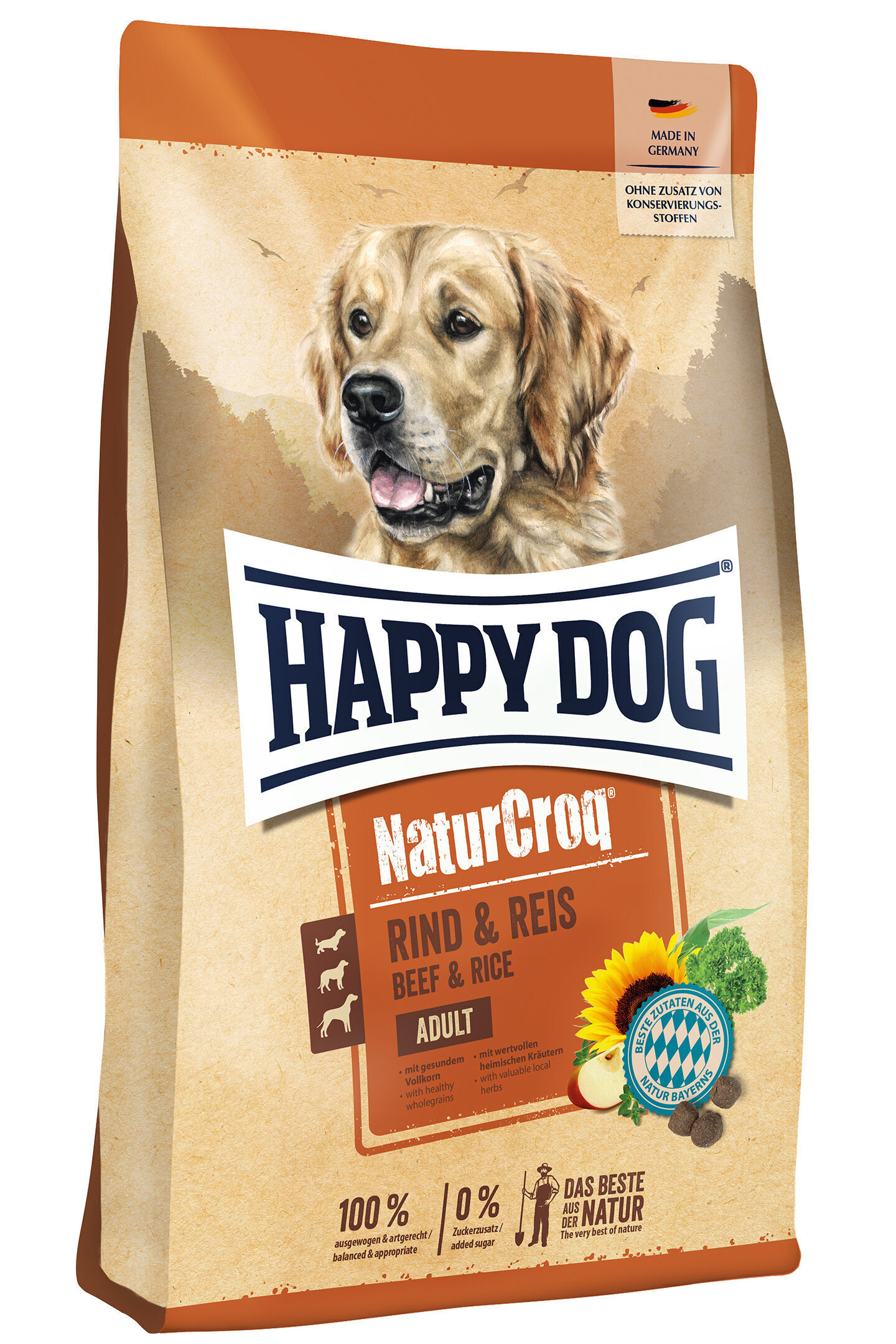 Die Verpackung zeigt Happy Dog NaturCroq Hundefutter mit einem Hundebild, enthält Text "RIND & REIS" und "100% ausgewogen". Oben rechts steht "MADE IN GERMANY".