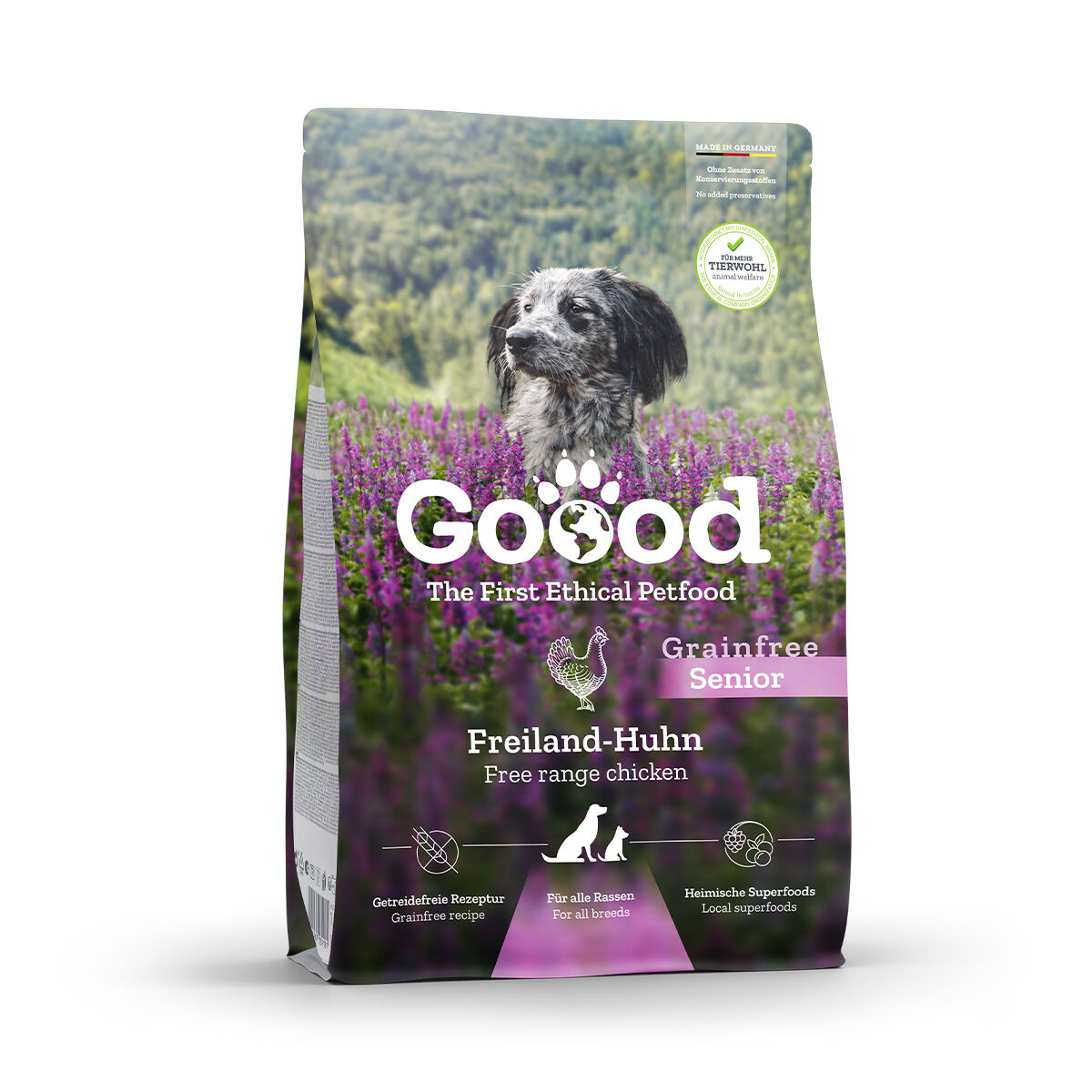 Eine Hundefutterverpackung mit einem schwarz-weißen Hund in einem lila Feld. Der Text besagt: Goood The First Ethical Petfood, Grainfree Senior, Freiland-Huhn, Getreidefreie Rezeptur, Für alle Rassen, Heimische Superfoods.