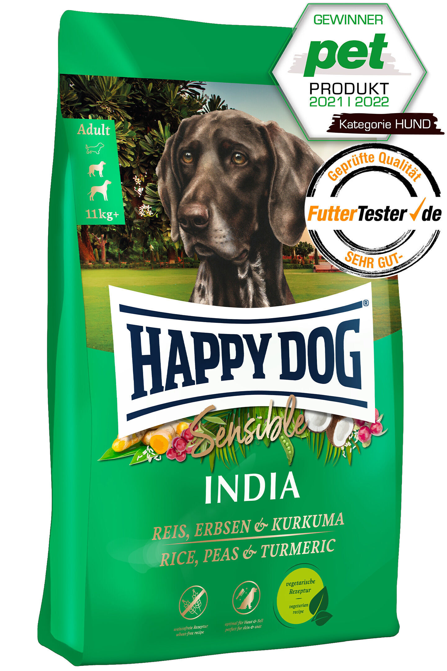 Packung Hundefutter von Happydog, Sorte "Sensible India", auf grünem Hintergrund mit Bild eines Hundes. Auszeichnungen und Zutaten wie Reis, Erbsen, Kurkuma sind sichtbar.